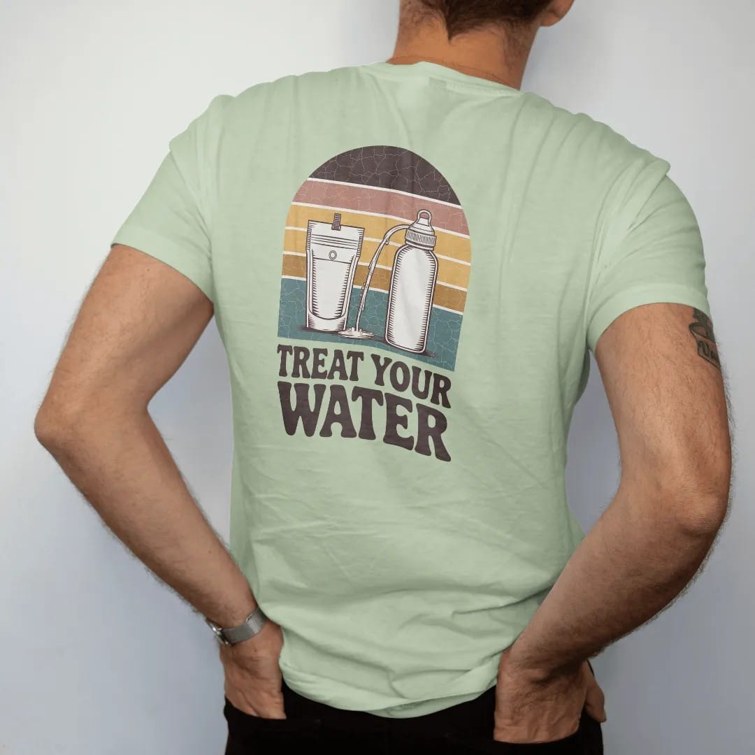 Man wearing a Light Green tee, seen from the back: a mountain stream flowing into a squeeze filter pouch and a water bottle, field-guide layout, faded 70s souvenir style, lettered "TREAT YOUR WATER" in chunky rounded 70s serif letters with a drop…