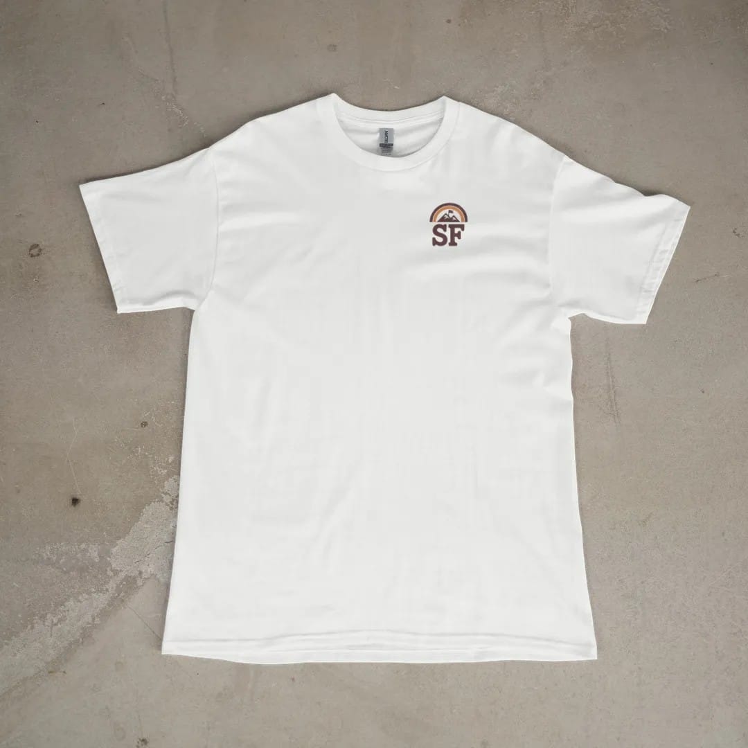 Front of a White tee laid flat, with the small Summit Fever logo on the left chest.