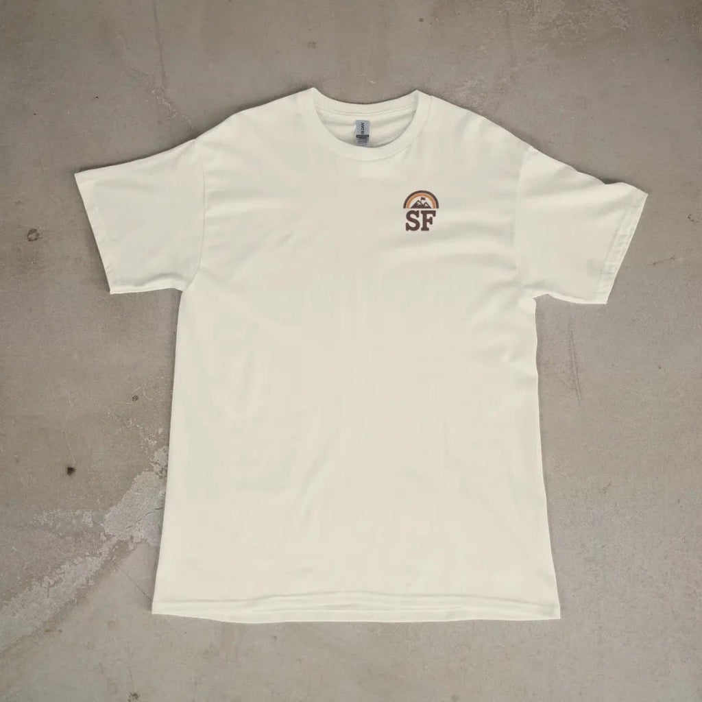 Front of a Ivory tee laid flat, with the small Summit Fever logo on the left chest.