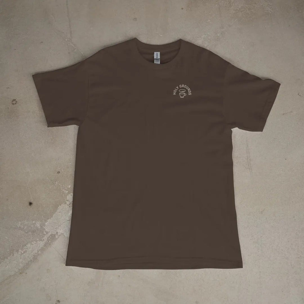 Front of a Espresso tee laid flat, with the small Holy Grounds logo on the left chest.
