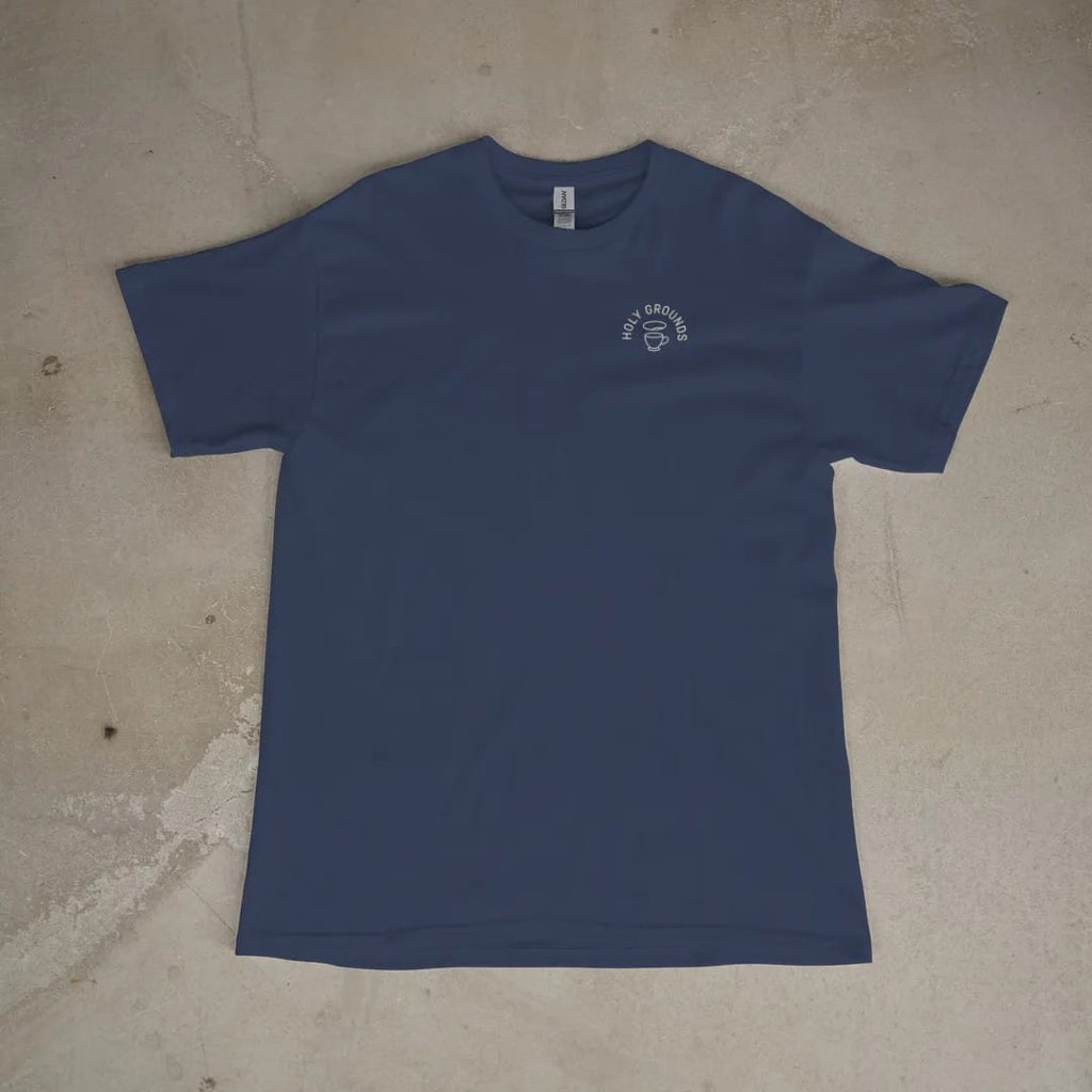 Front of a Navy tee laid flat, with the small Holy Grounds logo on the left chest.