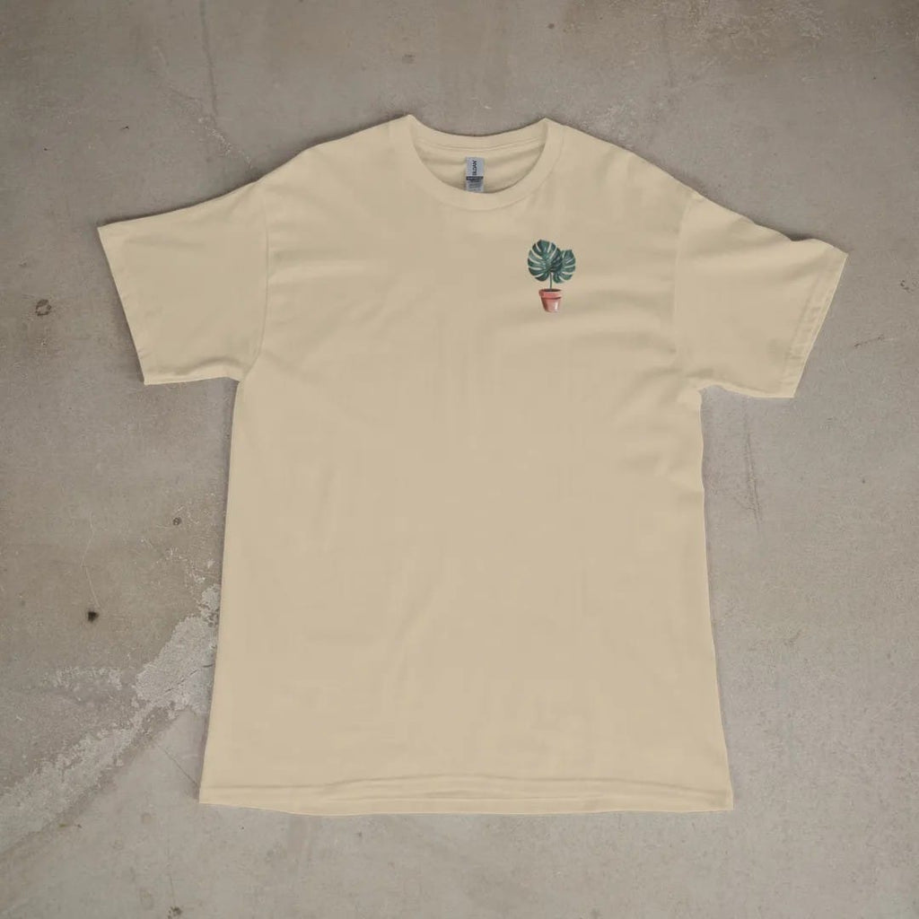 Front of a Sandstone tee laid flat, with the small Plant Parent Co. logo on the left chest.