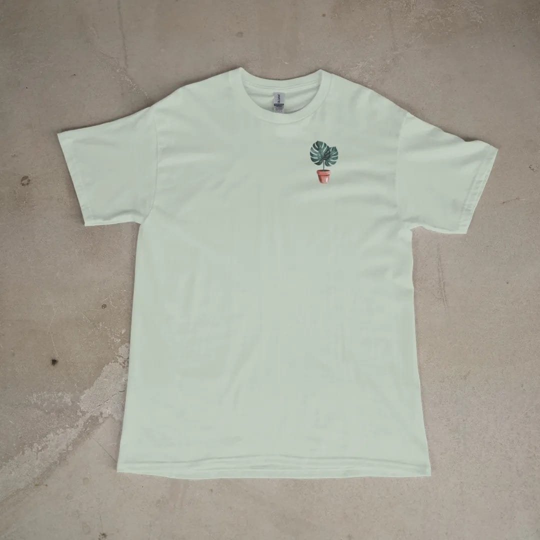 Front of a Bay tee laid flat, with the small Plant Parent Co. logo on the left chest.