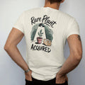 Man wearing a Ivory tee, seen from the back: a single small pot with one prized leaf under a tiny spotlight, a little cardboard shipping box beside it, "RARE PLANT" in loose brush script above and "ACQUIRED" below, painted in loose watercolor and…