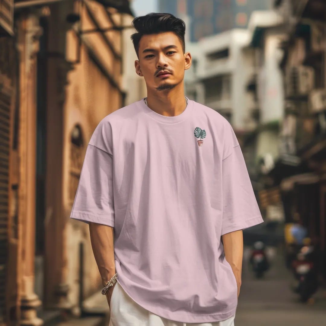 Man in a Blossom tee on a city street, with the small Plant Parent Co. logo on the left chest.