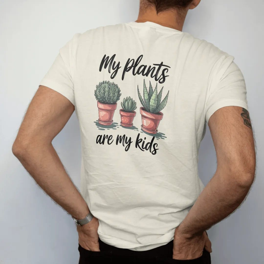 Man wearing a Ivory tee, seen from the back: three small pots in a row like a family photo, each plant a different height, "MY PLANTS" in loose brush script above and "ARE MY KIDS" below, painted in loose watercolor and ink with soft deep green,…