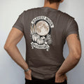 Man wearing a Espresso tee, seen from the back: back print: pumpkins, dried corn, bundled sage and apples beneath a huge harvest moon, curved "HARVEST MOON" above and "APOTHECARY" below in a ribbon, detailed vintage etching, fine crosshatching and…