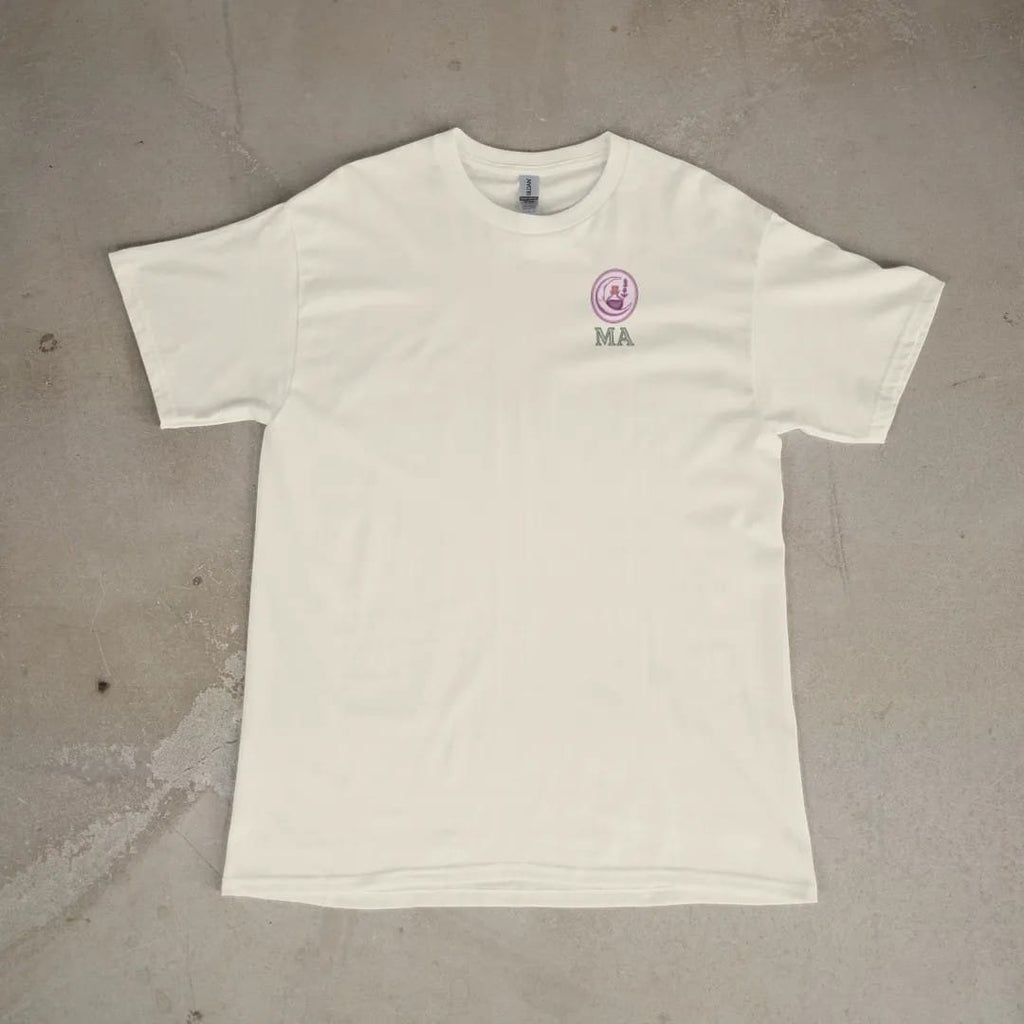 Front of a Ivory tee laid flat, with the small Midnight Apothecary logo on the left chest.