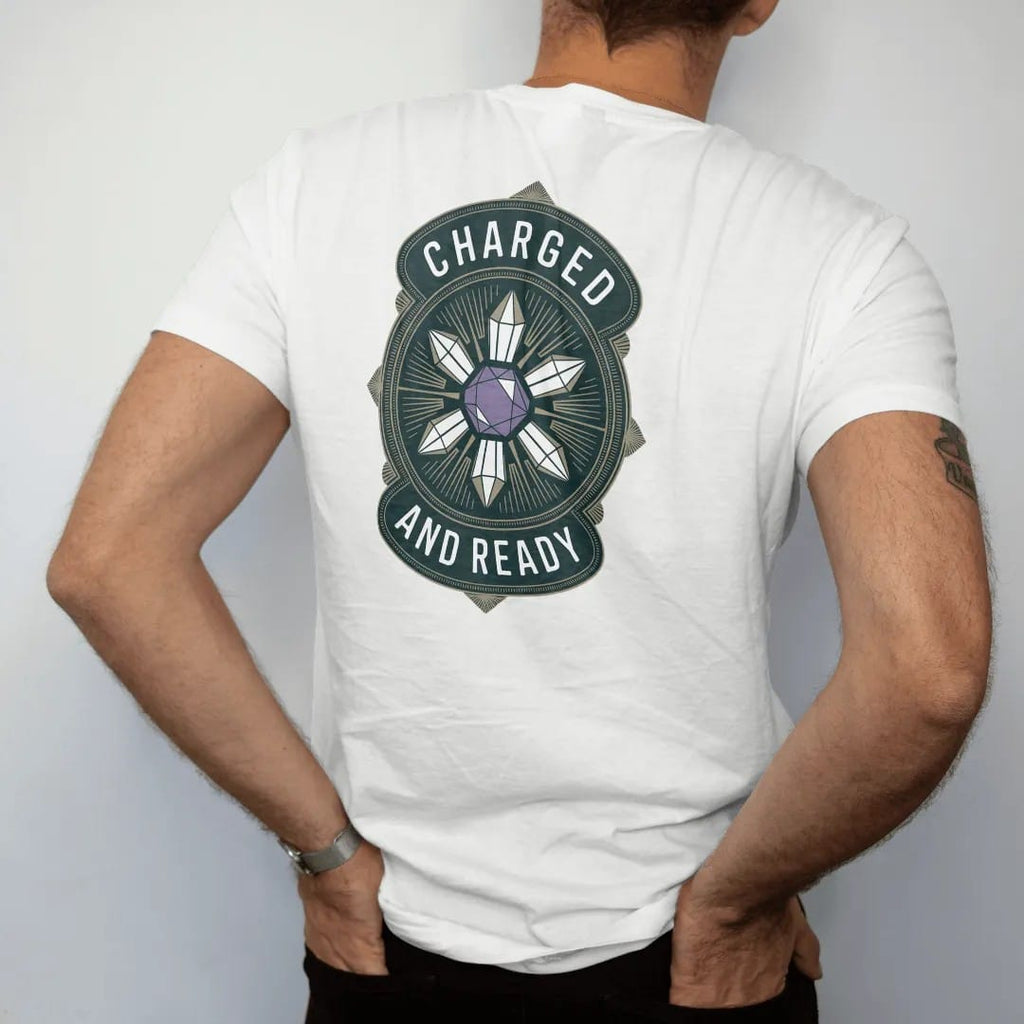 Man wearing a White tee, seen from the back: back print: A geometric crystal grid of six quartz points around a central amethyst joined by fine lines, small "CHARGED" above and "AND READY" below, antique apothecary-label engraving, fine…