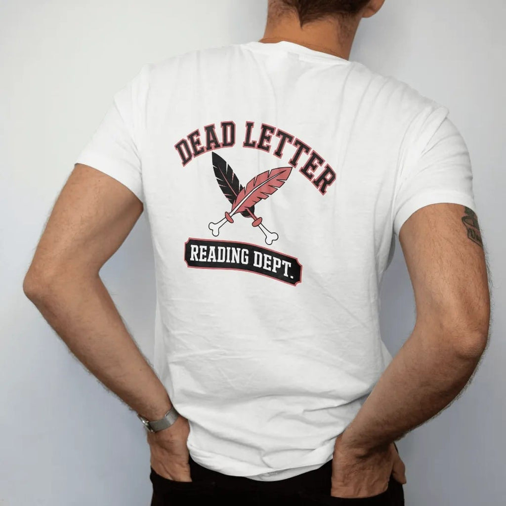 Man wearing a White tee, seen from the back: a varsity-style Dead Letter arch over a crossed quill and bone with a Reading Dept. bar below, in pulp halftone cream, red, yellow and blue.