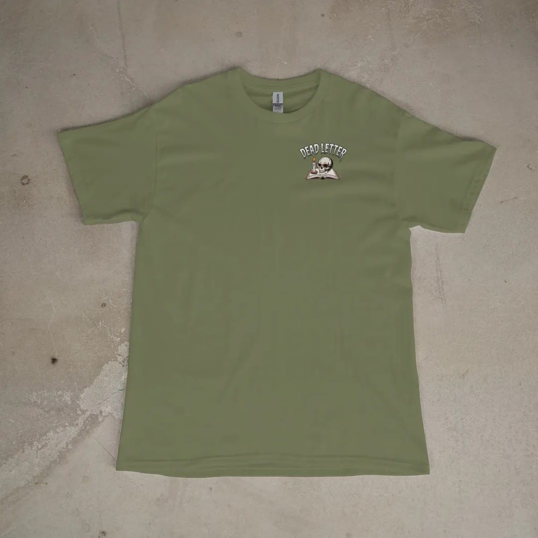 Front of a Moss tee laid flat, with the small Dead Letter Book Club logo on the left chest.