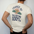 Man wearing a Ivory tee, seen from the back: a retro TV weather icon of a sun with a football face and puffy clouds, with "CHANCE OF" and "TAILGATING" and "100%" in chunky 70s slab-serif letters, printed in faded stadium green, washed brick red,…