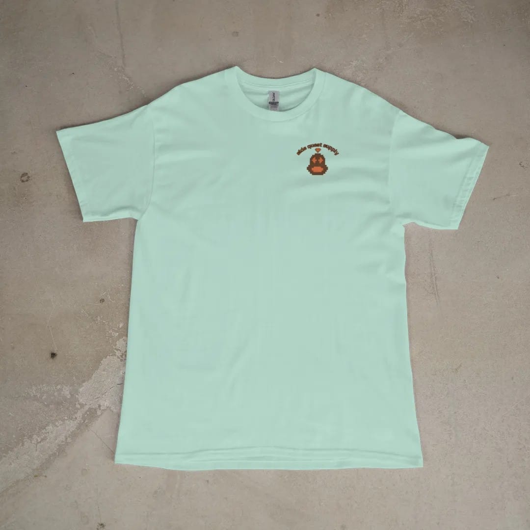Front of a Chalky Mint tee laid flat, with the small Side Quest Supply logo on the left chest.