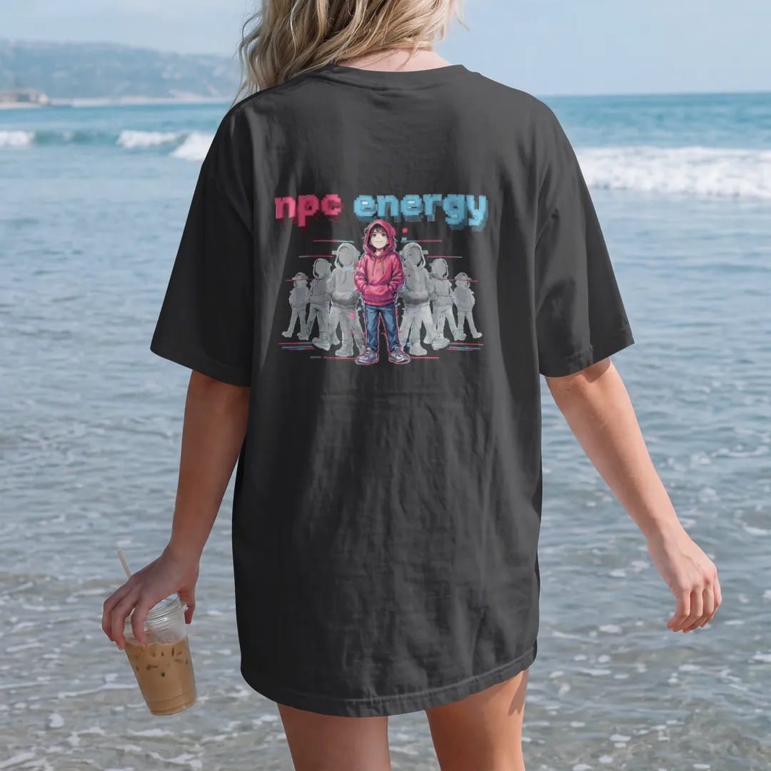 Woman on the beach in a Black tee, back view: a line of faded glitchy pixel characters with one anime-style kid in full color, under npc energy in a glitched pink, lime and blue pixel font.