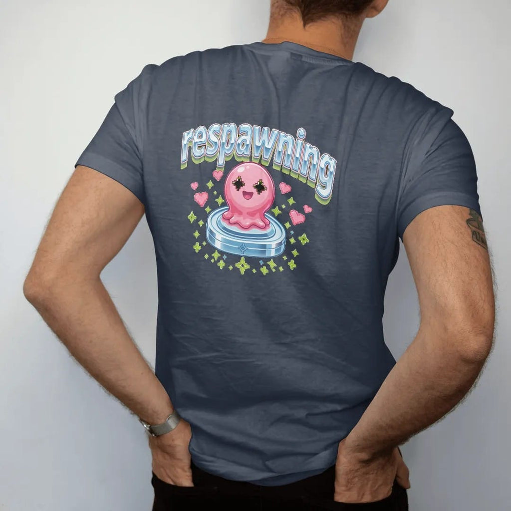 Man wearing a Midnight tee, seen from the back: blip the pixel slime rising from a glowing save-point pad with hearts and sparkles, under respawning in pink, lime and silver chrome bubble letters.