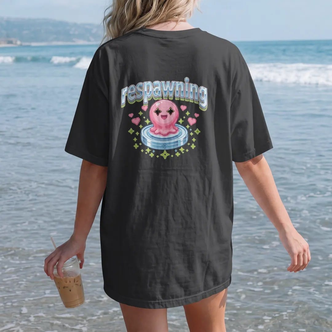 Woman on the beach in a Black tee, back view: blip the pixel slime rising from a glowing save-point pad with hearts and sparkles, under respawning in pink, lime and silver chrome bubble letters.