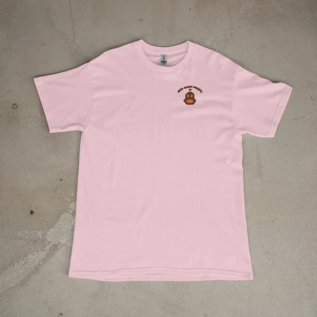 Front of a Blossom tee laid flat, with the small Side Quest Supply logo on the left chest.