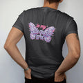 Man wearing a Black tee, seen from the back: two glossy chrome butterflies with glitch trails framing in my in brush script and side quest era in silver, lilac and pink chrome bubble letters.