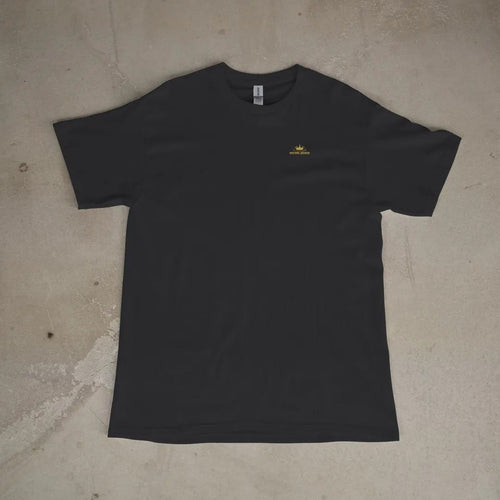 Front of a Black tee laid flat, with the small Velvet Static logo on the left chest.