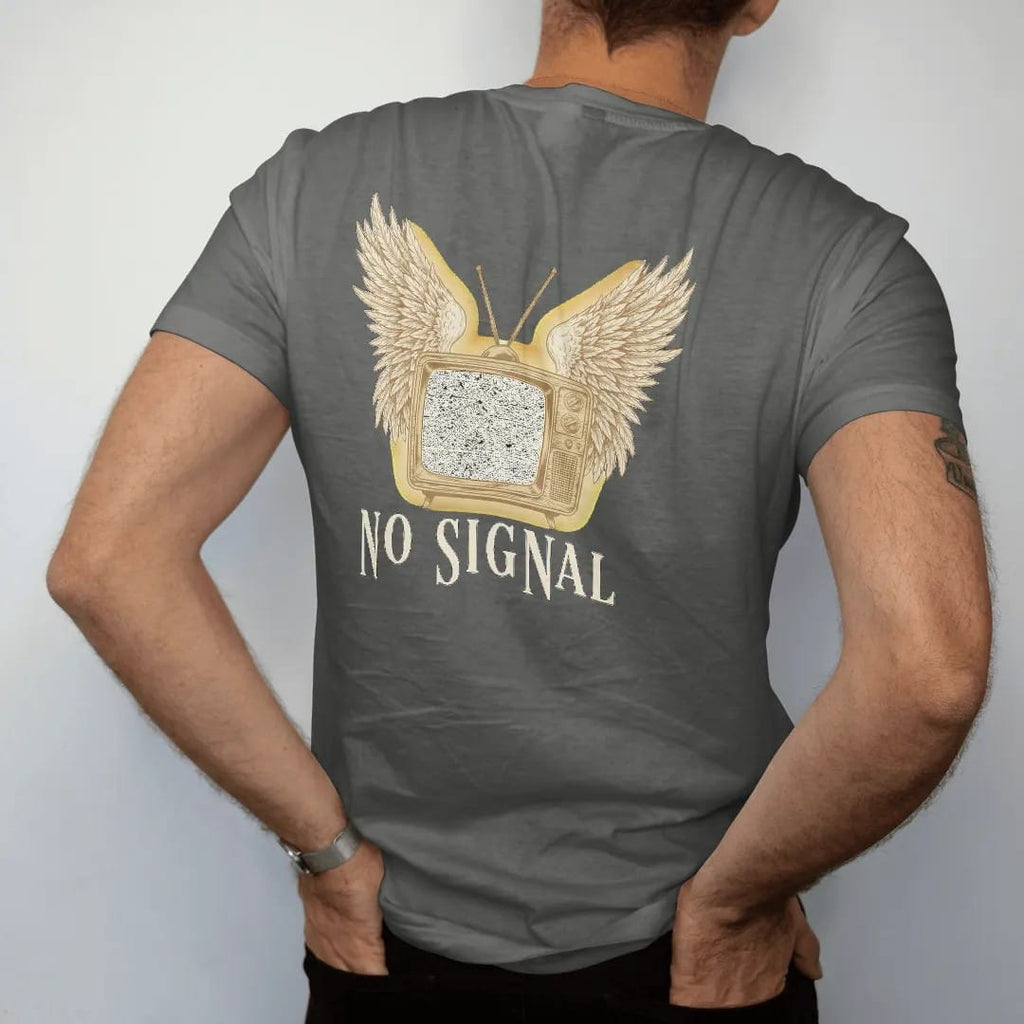 Man wearing a Pepper tee, seen from the back: a vintage cabinet television with angel wings and a screen full of static, above No Signal in widely spaced fashion serif capitals, in bone cream, chrome silver and antique gold.
