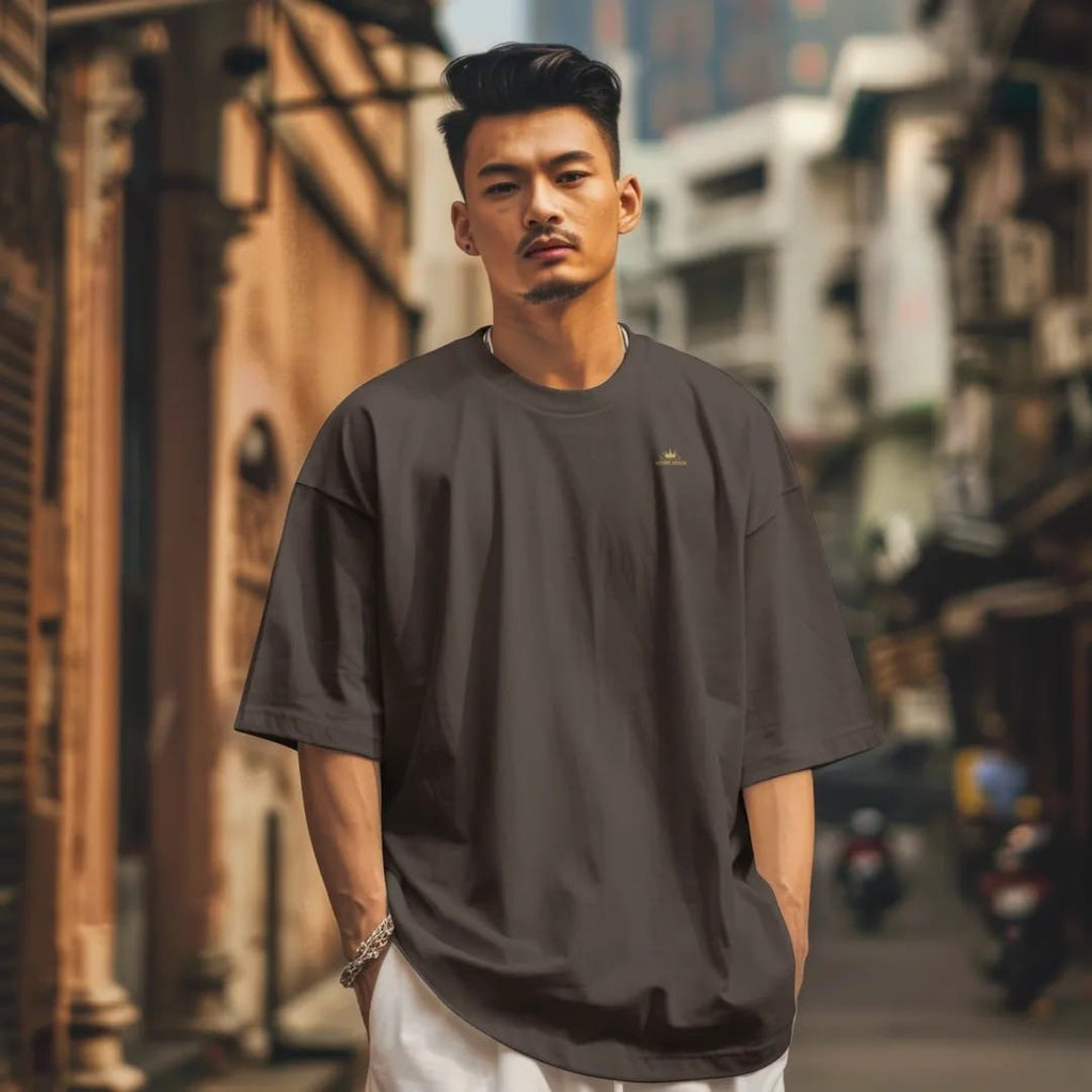 Man in a Espresso tee on a city street, with the small Velvet Static logo on the left chest.