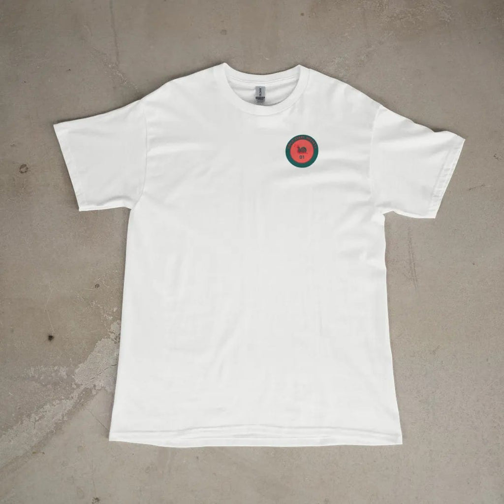 Front of a White tee laid flat, with the small Cold Start Society logo on the left chest.