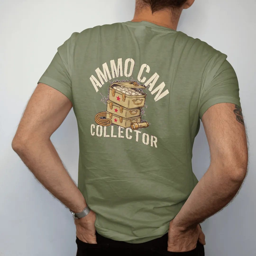 Man wearing a Moss tee, seen from the back: a stack of three military-style ammo cans with one open, beside a rope coil and flashlight, Ammo Can Collector in stencil, in sand khaki, brass gold, cream and red.