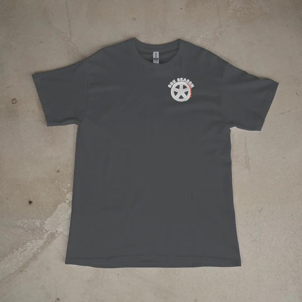 Front of a Graphite tee laid flat, with the small Box Season Customs logo on the left chest.