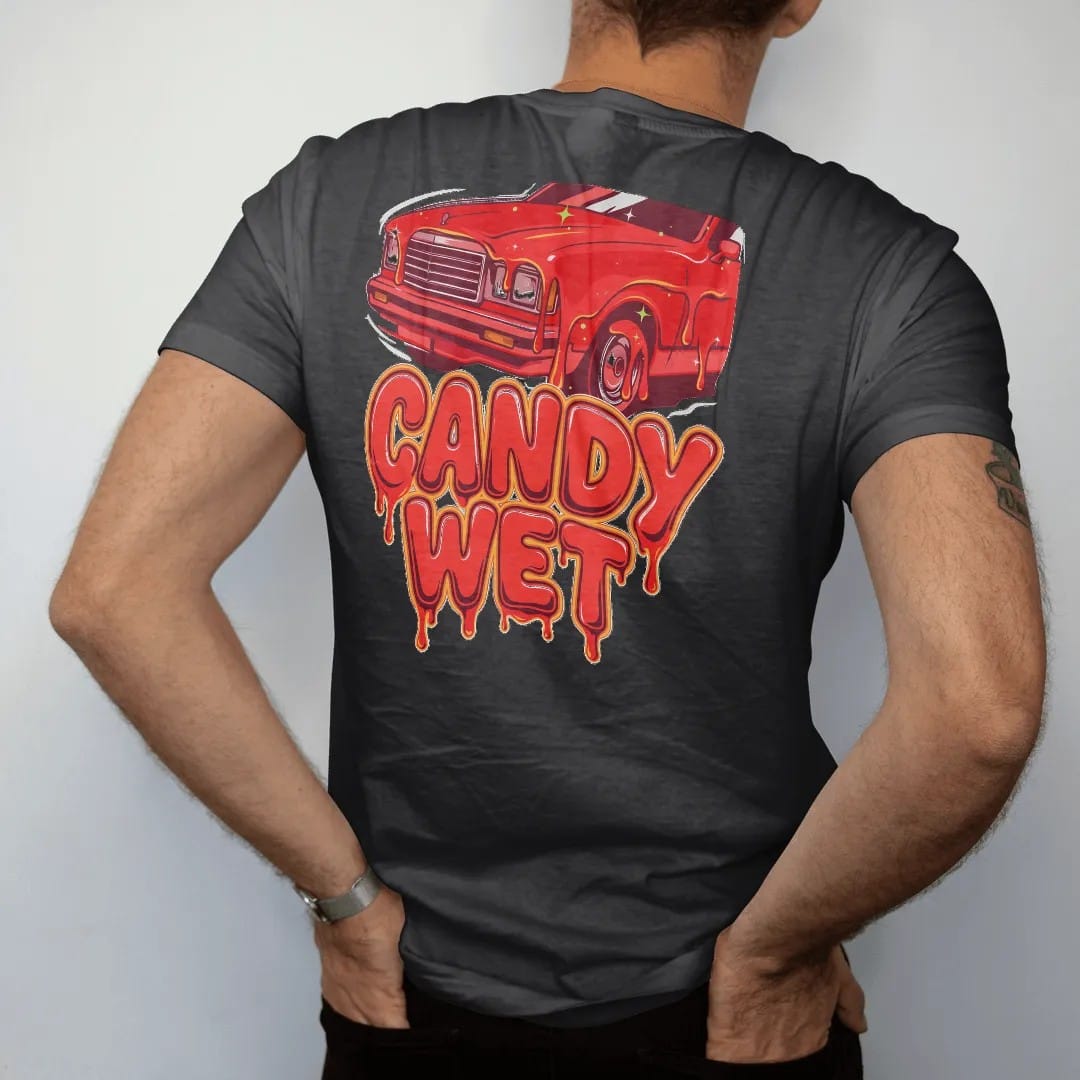 Man wearing a Black tee, seen from the back: glossy candy red paint dripping off a car hood with Candy Wet in big dripping letters, in red, silver, orange and lime.