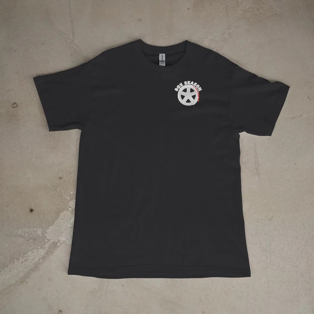 Front of a Black tee laid flat, with the small Box Season Customs logo on the left chest.