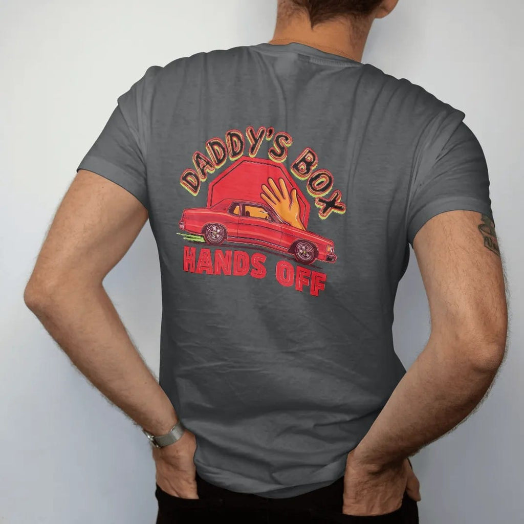 Man wearing a Graphite tee, seen from the back: a boxy 80s sedan on big chrome rims with a cartoon hand reaching for it and a stop sign, under Daddy's Box and over Hands Off.