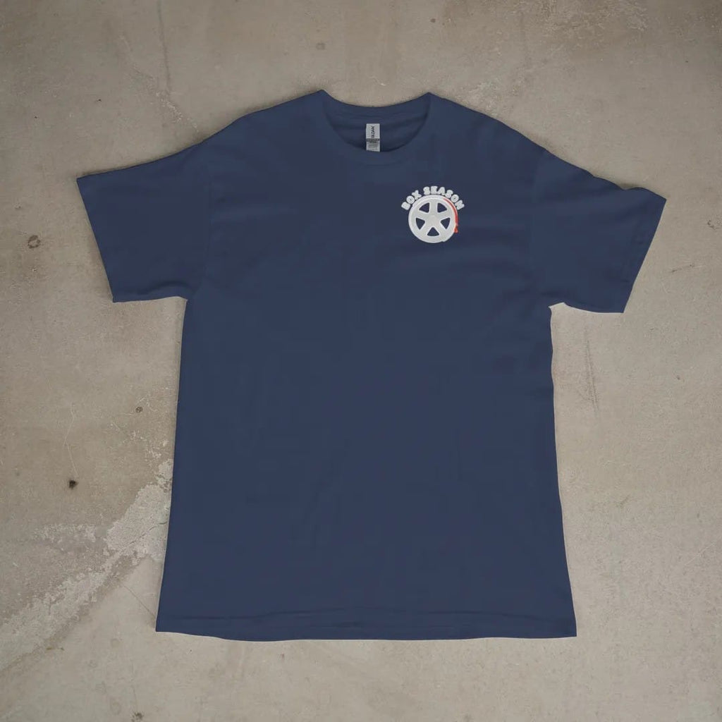 Front of a Navy tee laid flat, with the small Box Season Customs logo on the left chest.