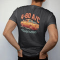 Man wearing a Black tee, seen from the back: a square-body pickup cruising with all windows down and a hand surfing the wind, under 4-60 A/C and over Always Works.