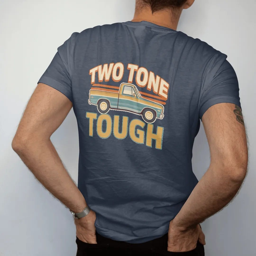 Man wearing a Midnight tee, seen from the back: a two-tone square-body pickup split by chrome trim in front of 70s stripes, under Two Tone and over Tough.