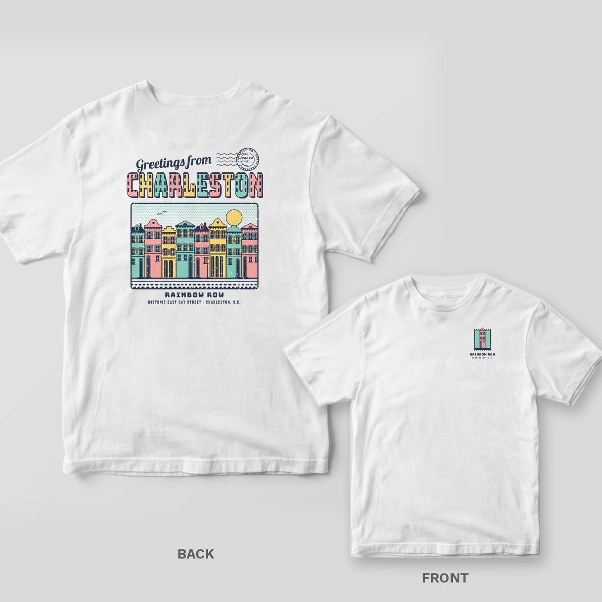 White Comfort Colors tee shown back and front: a pastel Greetings from Charleston Rainbow Row postcard on the back and a small row-house stamp on the left chest.