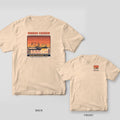 Ivory Comfort Colors tee shown back and front: a dusk scene of Shem Creek shrimp boats on the back and a small shrimp-trawler panel on the left chest.