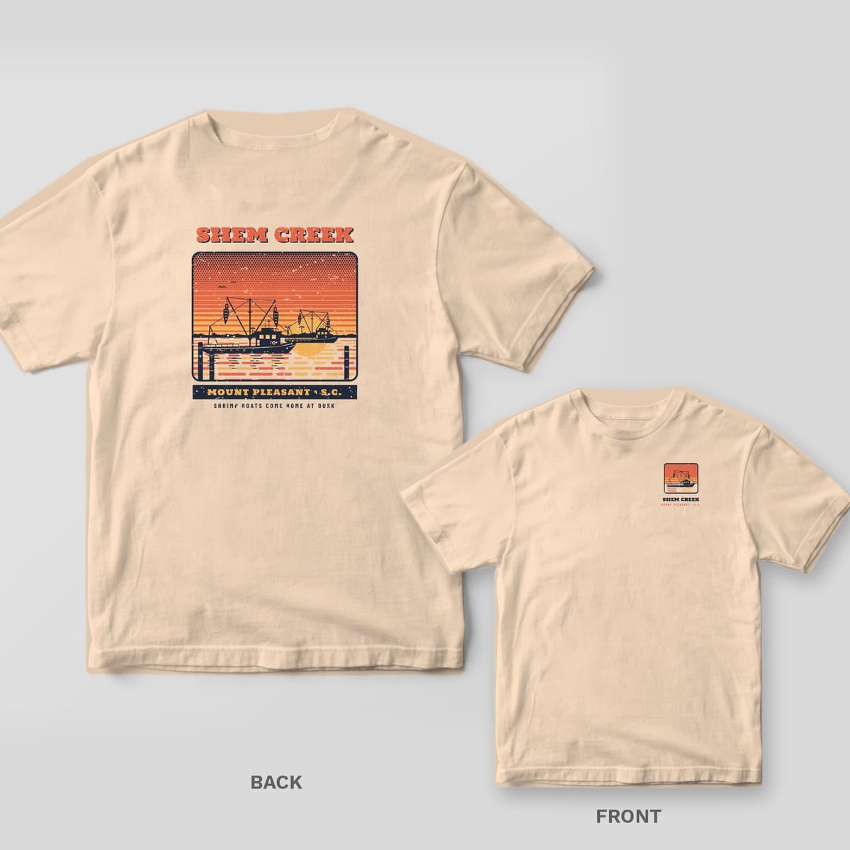 Ivory Comfort Colors tee shown back and front: a dusk scene of Shem Creek shrimp boats on the back and a small shrimp-trawler panel on the left chest.