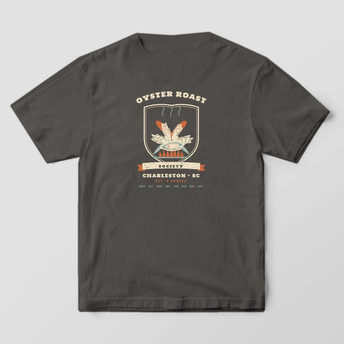 Back of a Pepper Comfort Colors 1717 tee with a cream, rust and sage crest reading Oyster Roast Society, Charleston SC, Est. R Months, with an oyster cluster over crossed knives.