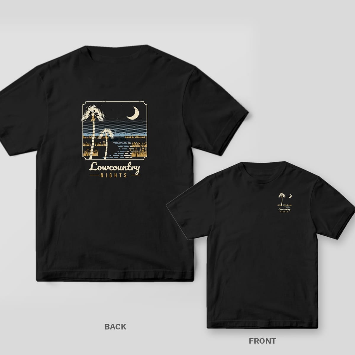 Black Comfort Colors tee shown back and front: a night marsh scene with palmettos and a crescent moon on the back and a small palmetto and moon on the left chest.