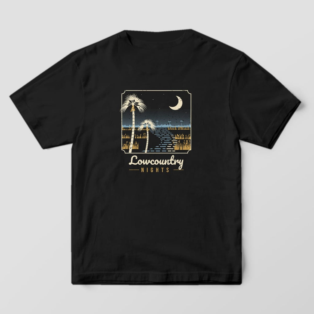Back of a Black Comfort Colors 1717 tee with a cream, blue and gold marsh at night, two palmettos, a crescent moon and a winding creek, titled Lowcountry Nights.