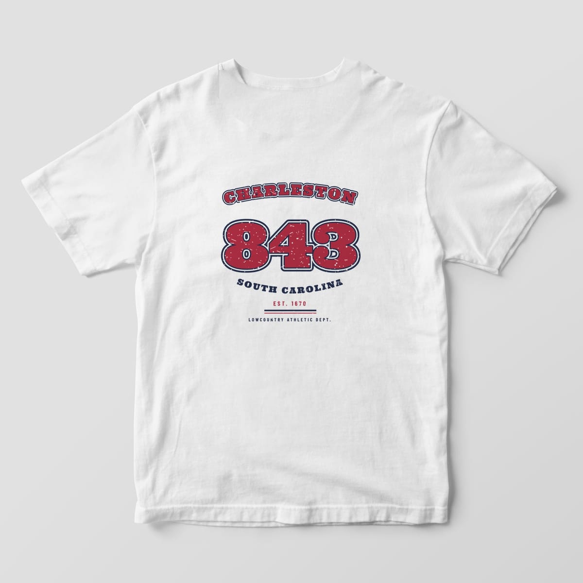 Back of a White Comfort Colors 1717 tee with a garnet and navy varsity design: CHARLESTON arched over a large outlined 843 and SOUTH CAROLINA below.