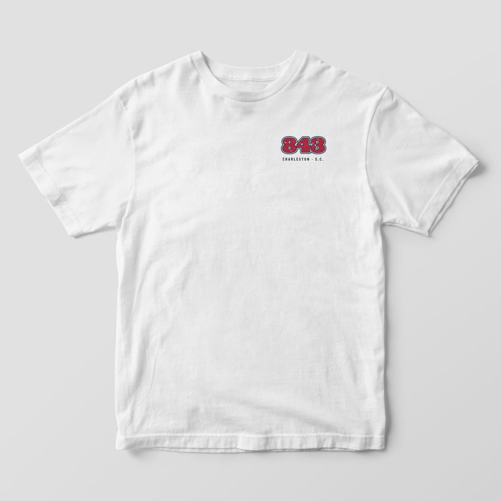 Front of a White Comfort Colors 1717 tee with a small left-chest garnet 843 with navy outlines above the words Charleston S.C.