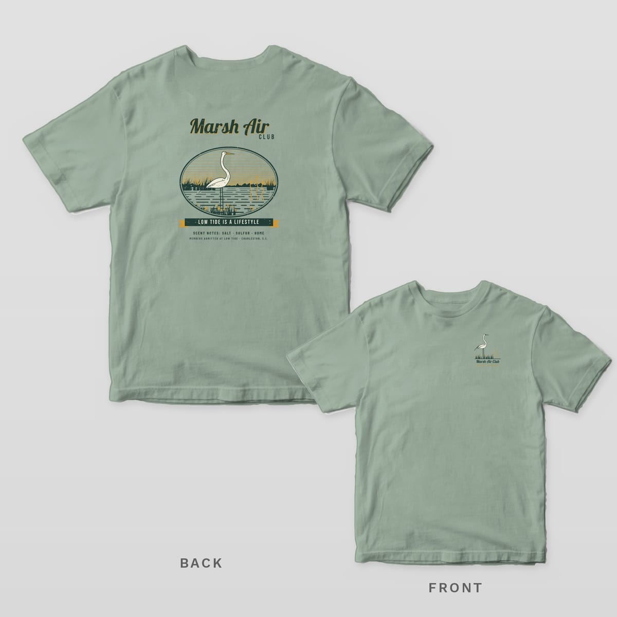 Bay green Comfort Colors tee shown back and front: a Marsh Air Club egret badge reading Low Tide Is a Lifestyle on the back and a small egret on the left chest.