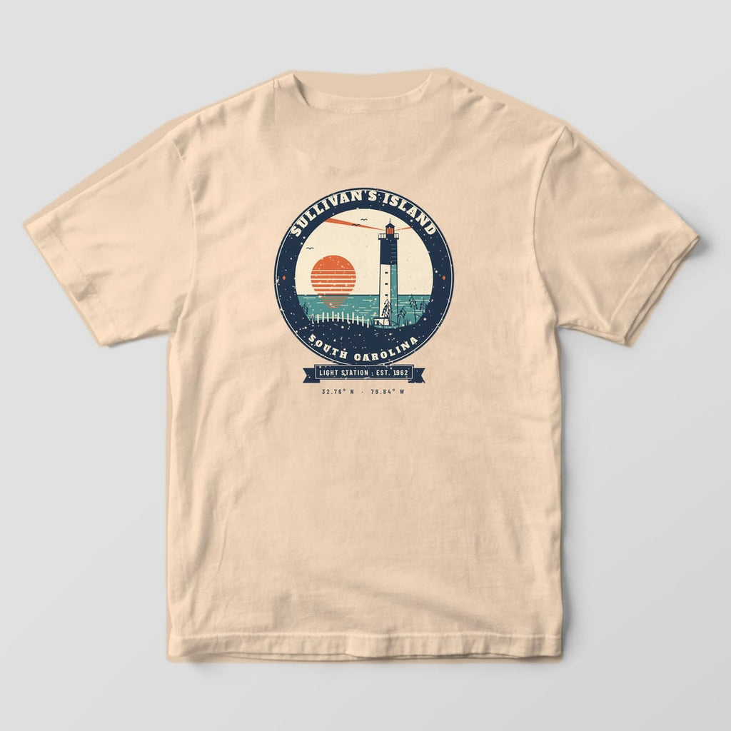 Back of a Ivory Comfort Colors 1717 tee with a navy, coral and teal badge of the triangular Sullivan's Island lighthouse at sunrise over sea oats.