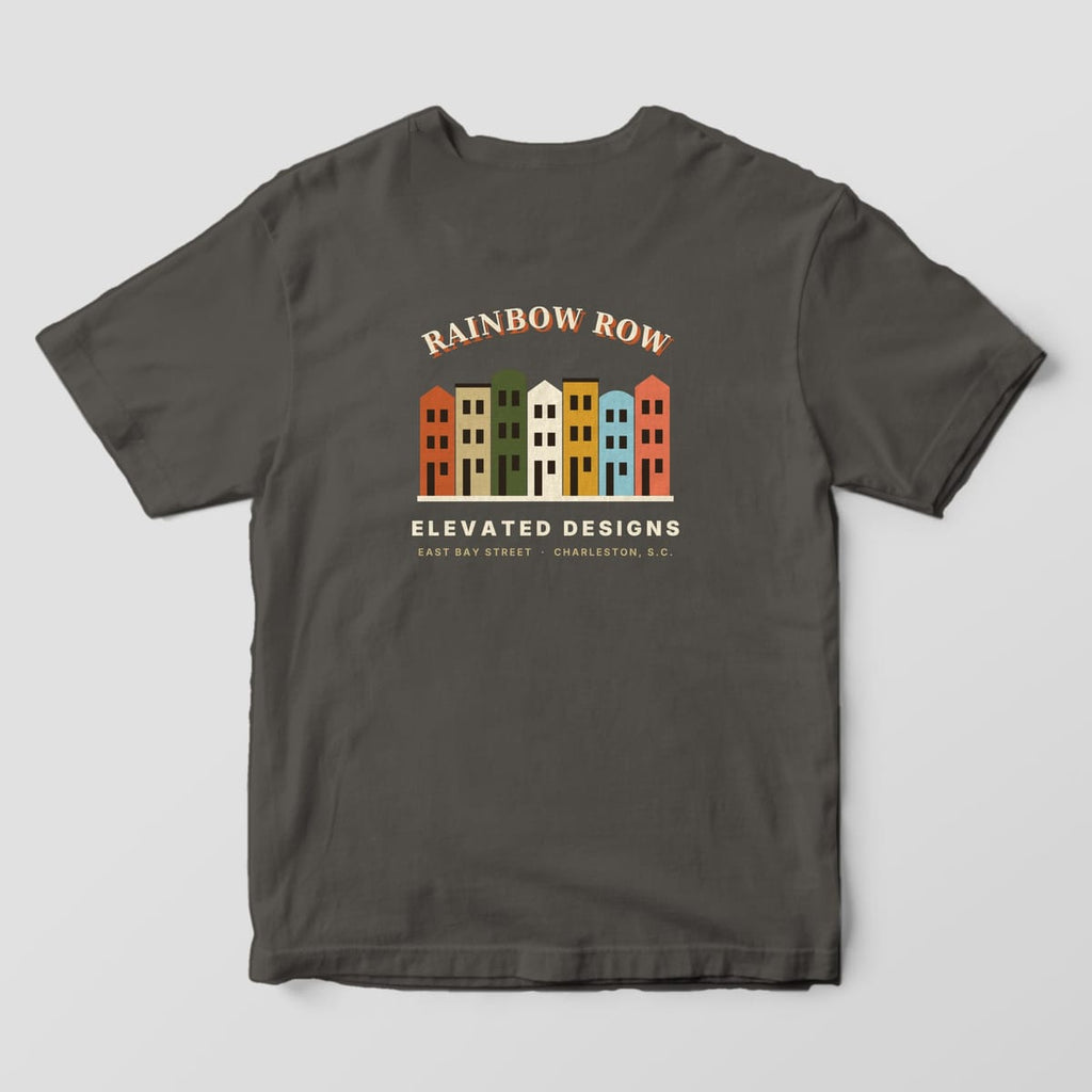 Back of a Pepper Comfort Colors 1717 tee with RAINBOW ROW arched over seven row houses in rust, tan, olive, cream, gold, light blue and coral, with ELEVATED DESIGNS and EAST BAY STREET · CHARLESTON, S.C. below.