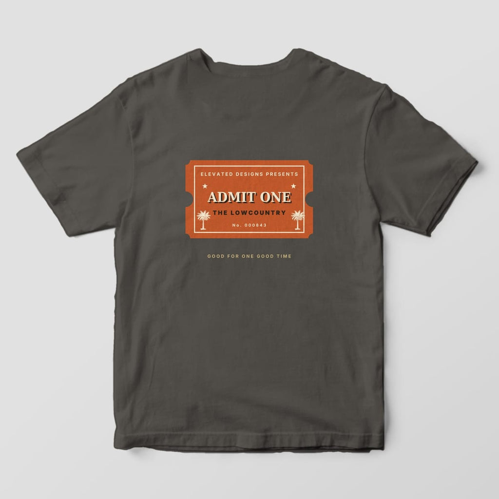 Back of a Pepper Comfort Colors 1717 tee with a rust ticket stub reading ELEVATED DESIGNS PRESENTS, ADMIT ONE, THE LOWCOUNTRY and No. 000843 with two palmettos, above GOOD FOR ONE GOOD TIME.