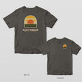 Pepper Comfort Colors tee shown back and front: an arched salt marsh sunset scene over SALT MARSH on the back and a small marsh sunset arch on the left chest.