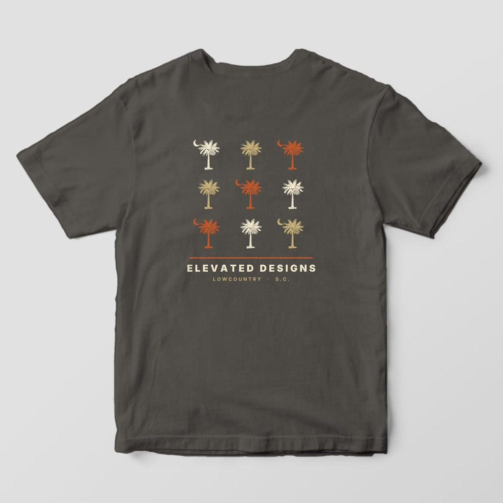 Back of a Pepper Comfort Colors 1717 tee with a three-by-three grid of cream, tan and rust palmetto trees, five with crescent moons, above ELEVATED DESIGNS and LOWCOUNTRY · S.C.