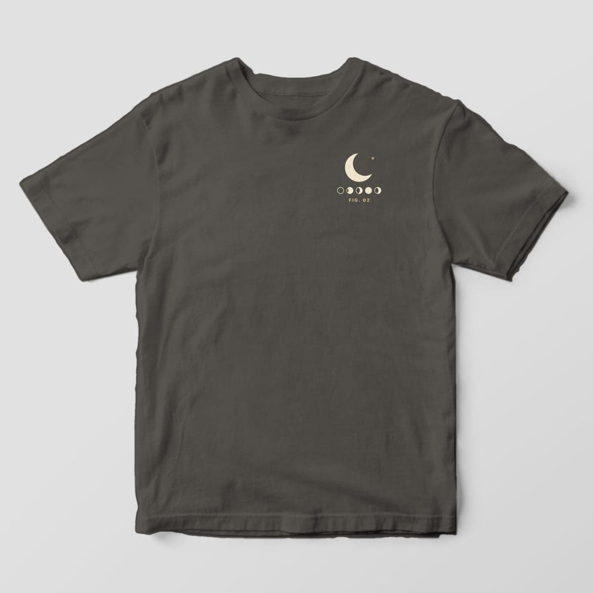 Front of a Pepper Comfort Colors 1717 tee with a small left-chest cream crescent moon and star above a row of five moon phases and FIG. 02.