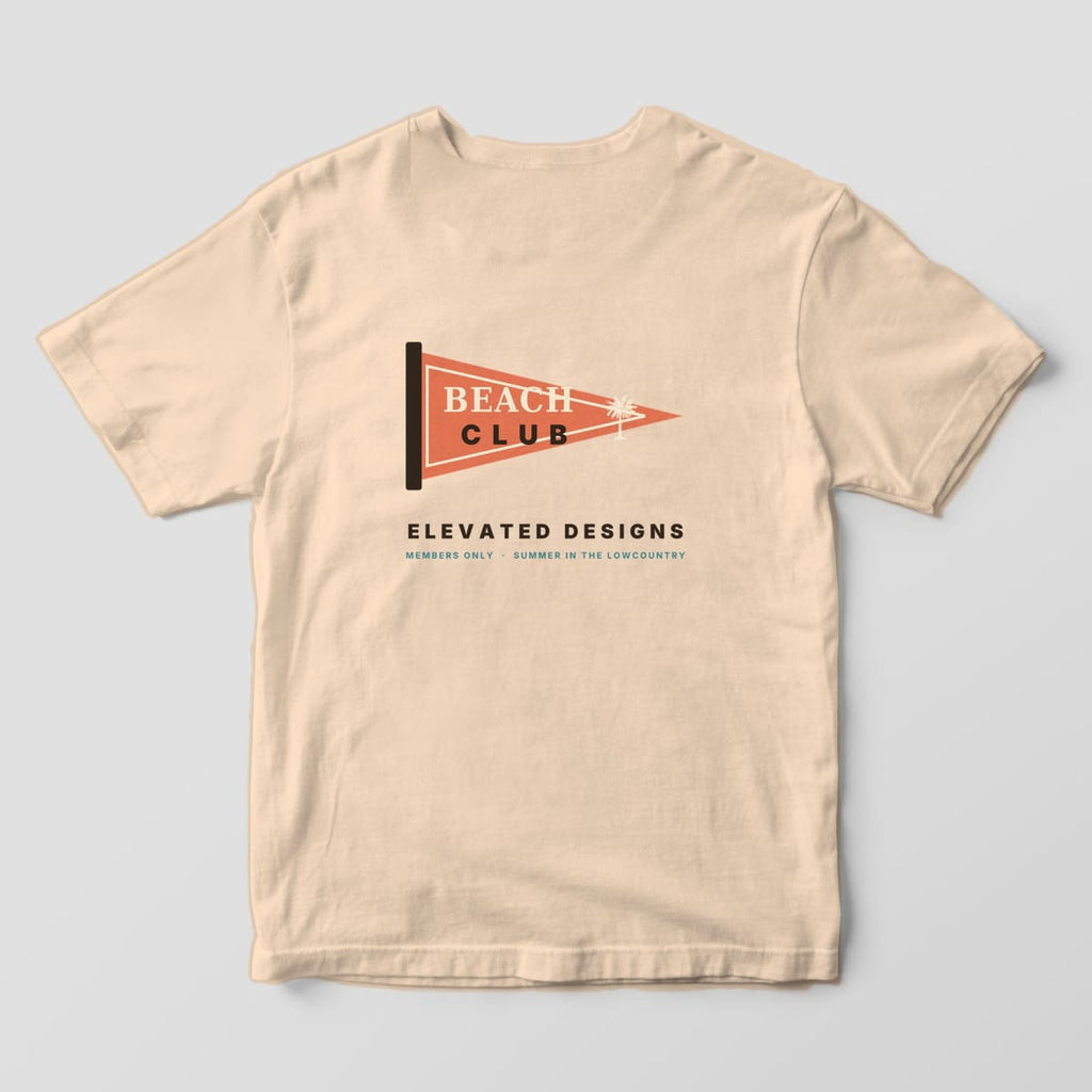 Back of an Ivory Comfort Colors 1717 tee with a coral pennant flag reading BEACH CLUB with a small palmetto, above ELEVATED DESIGNS and MEMBERS ONLY · SUMMER IN THE LOWCOUNTRY.